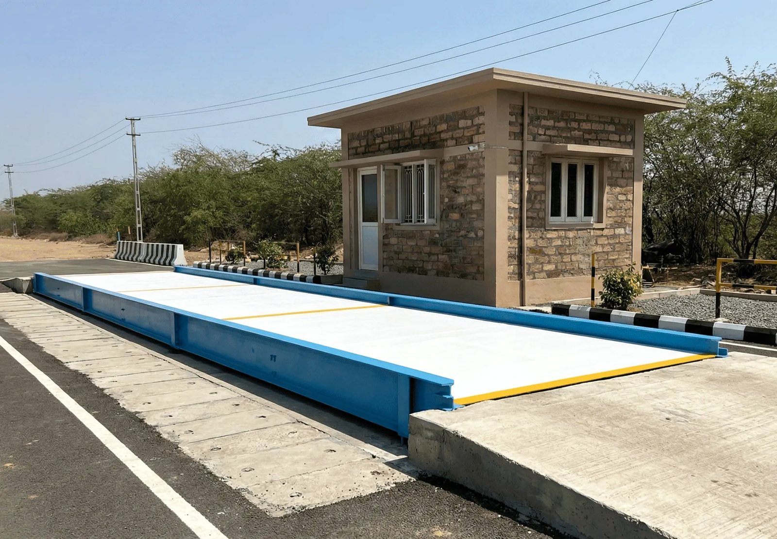 Symphony Concrete / RCC weighbridge: Concrete deck in a blue steel frame, with weigh cabin