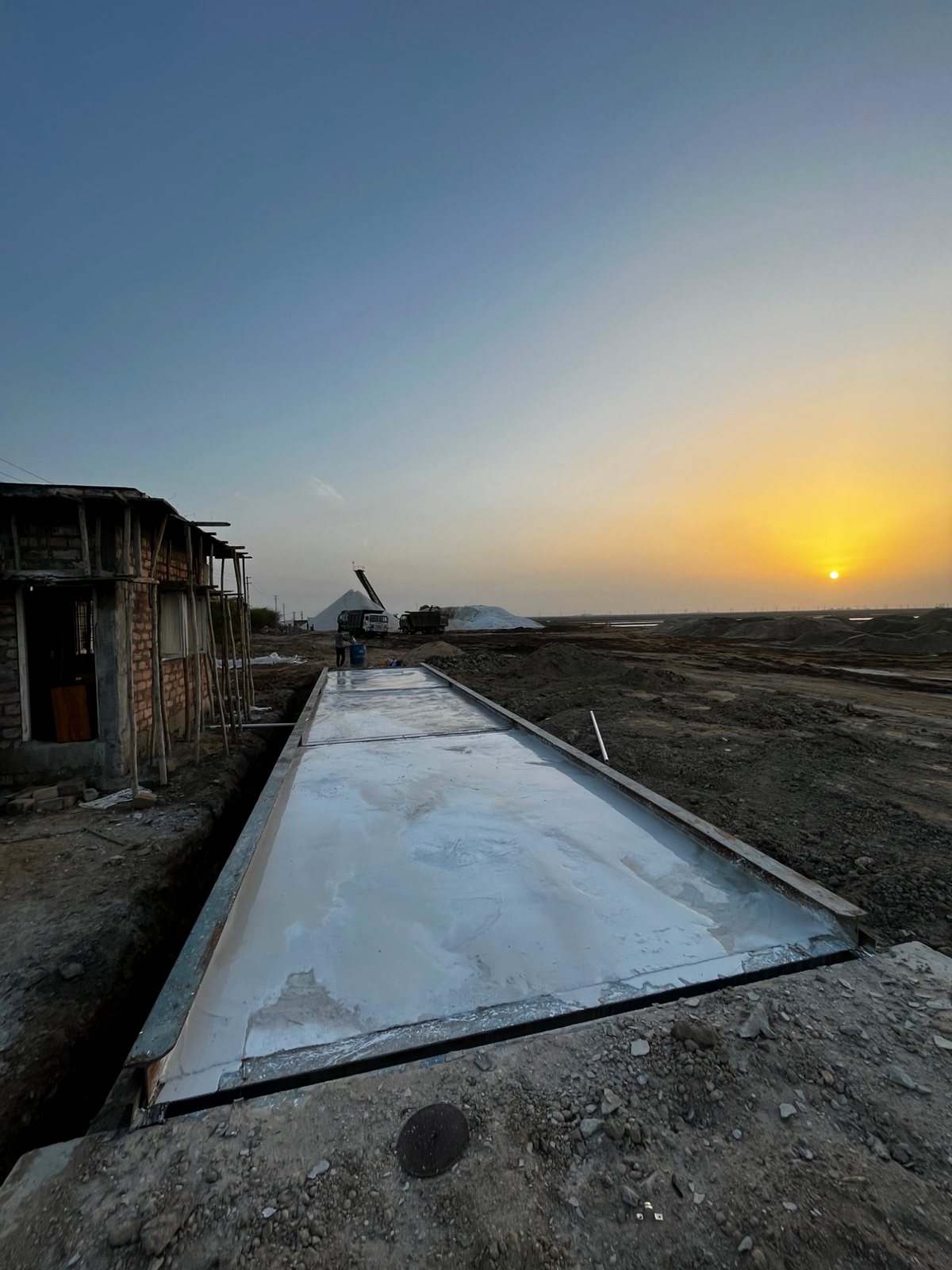 Concrete / RCC weighbridge: Concrete deck at a salt works, at sunset