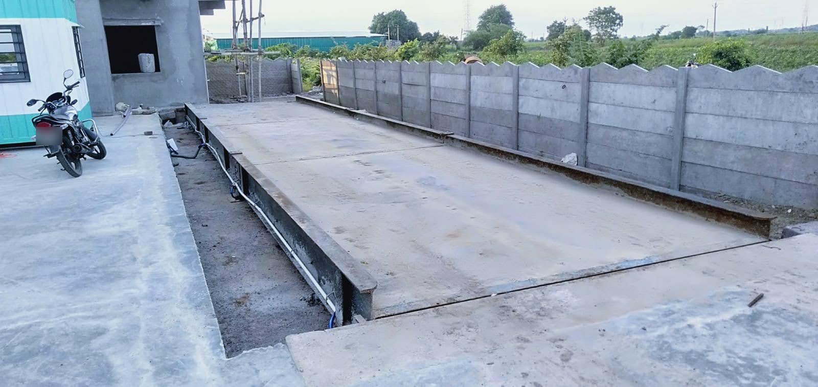Concrete / RCC weighbridge: Steel-framed concrete deck beside the compound wall